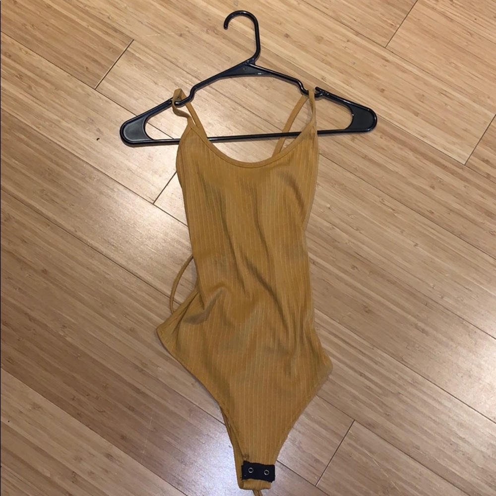 Mustard body suit size medium.